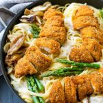 This recipe for chicken carbonara is crispy chicken with asparagus and wild mushrooms, all in a creamy sauce over spaghetti. A quick and easy dinner option that the whole family will love! ad