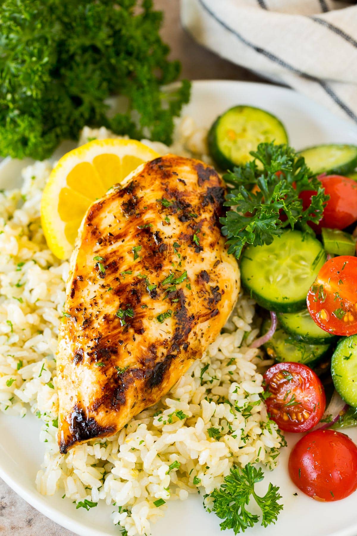 Grilled chicken on rice with salad on the side.