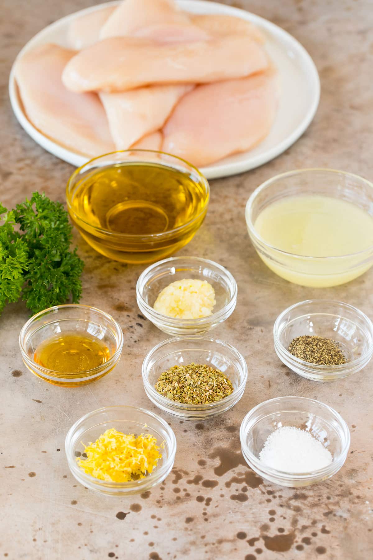Ingredients including chicken, olive oil, lemon juice and seasonings.