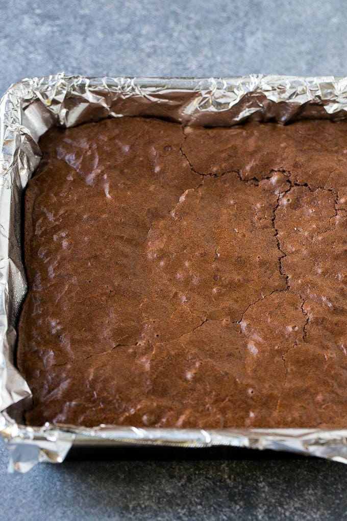 Baked brownies in a square pan.