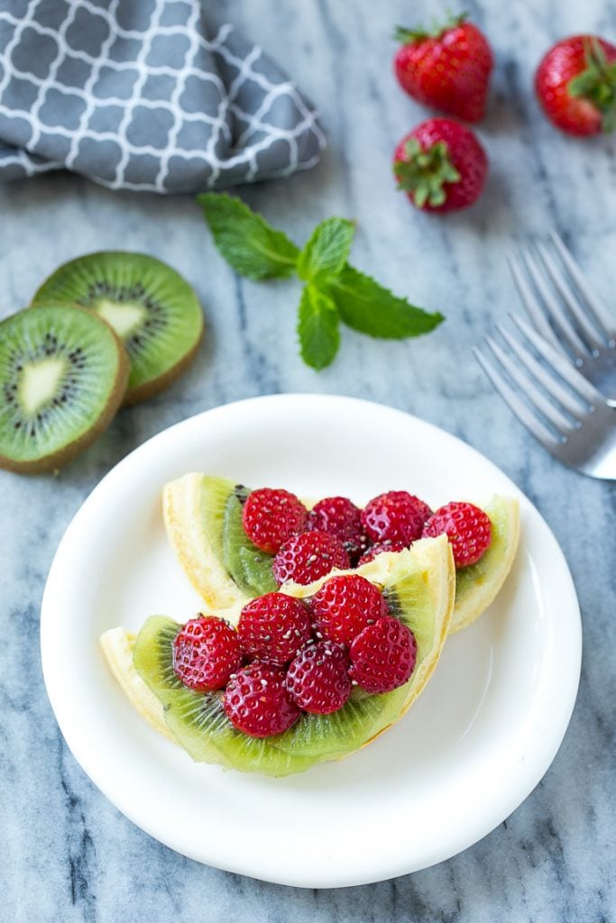 Have fun with your breakfast and turn regular old toaster waffles into watermelon designs with Nutella and fresh fruit! ad