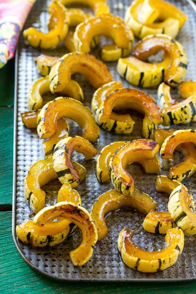 A sheet pan of a cooked winter squash recipe.