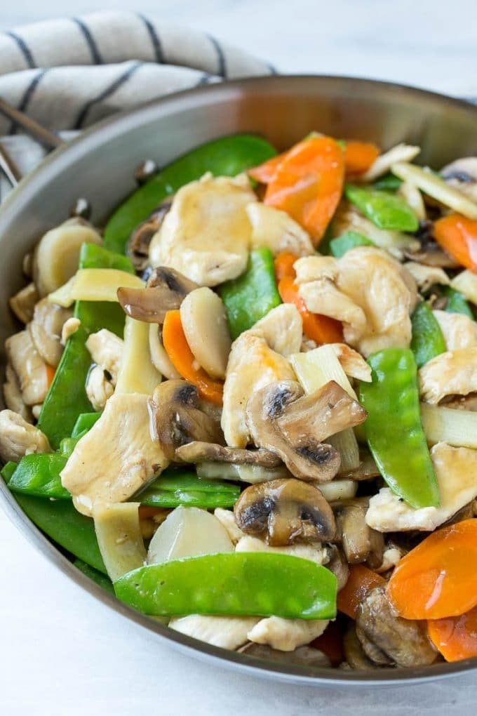 Chicken, mushrooms, snow peas and carrots in a savory sauce.