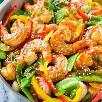 This recipe for teriyaki shrimp stir fry is shrimp and vegetables coated in a homemade teriyaki sauce and served over brown rice. An easy and healthy dinner option that's ready in less than 20 minutes! AD