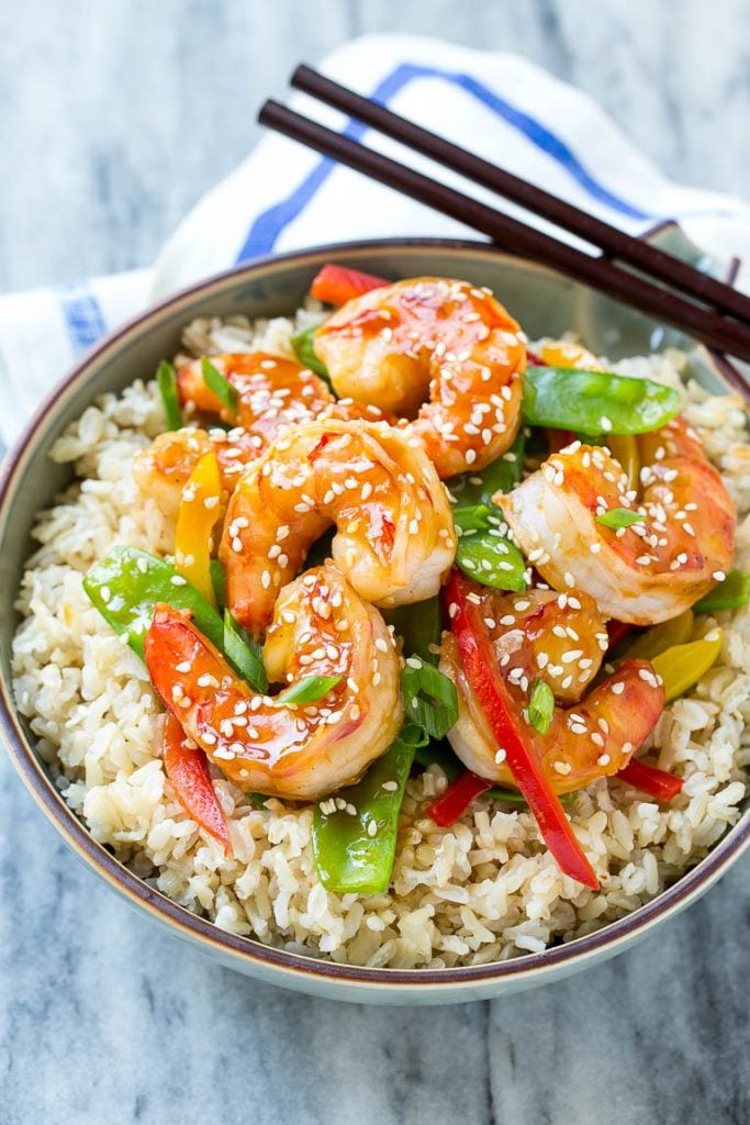 Shrimp stir fry with veggies served over brown rice.