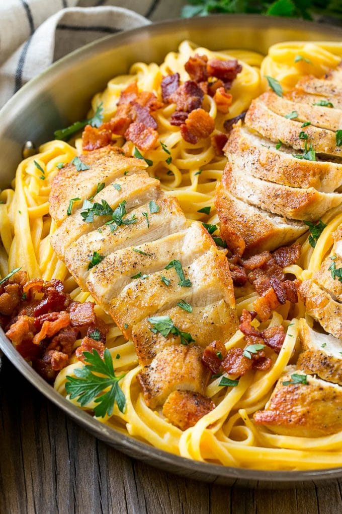This recipe for butternut squash pasta is linguine in a creamy butternut squash sauce, topped with chicken, bacon and herbs. An easy and delicious dinner that's perfect for fall! #FamilyPastaTime #ad