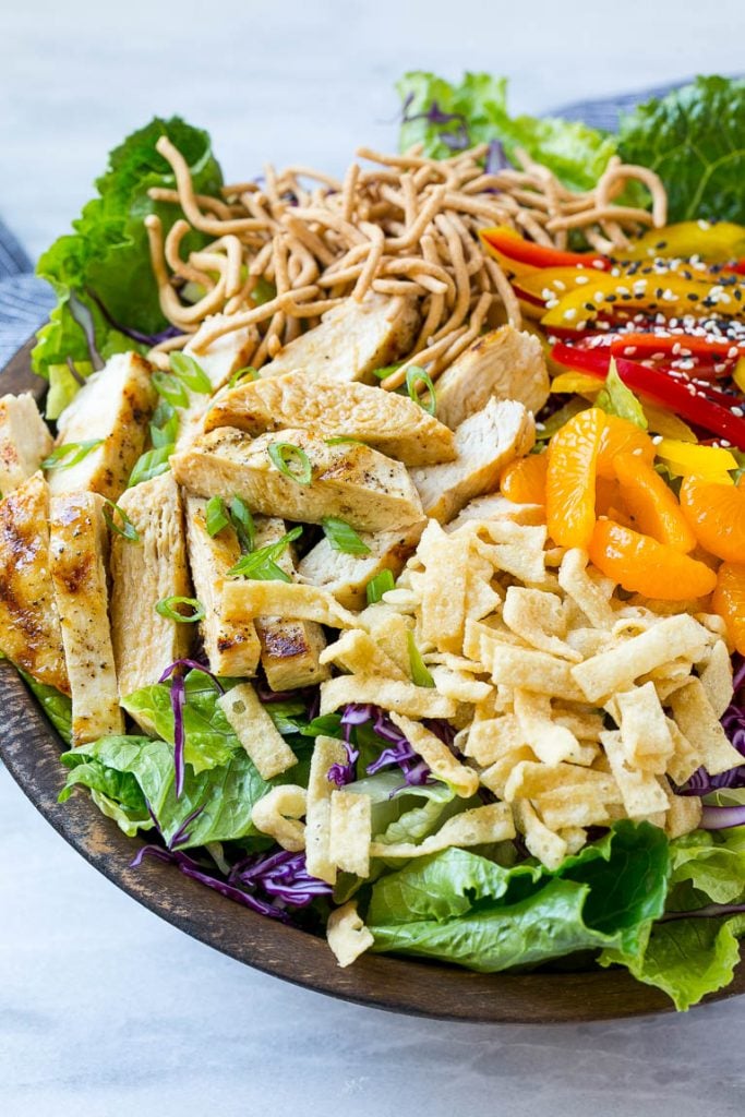 This recipe for Chinese chicken salad is loaded with chicken, veggies, won tons and mandarin oranges, all tossed in a sesame ginger dressing. My all time favorite salad!