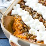 This recipe for a sweet potato casserole with marshmallows is mashed spiced sweet potatoes, topped with both a pecan streusel topping and plenty of mini marshmallows. A holiday classic that's a family favorite!