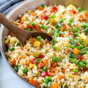 This recipe for veggie fried rice is chock full of colorful veggies and is ready in just 20 minutes! This vegetarian fried rice is the perfect quick and easy side dish that the whole family will love. #WokWednesday #sponsored