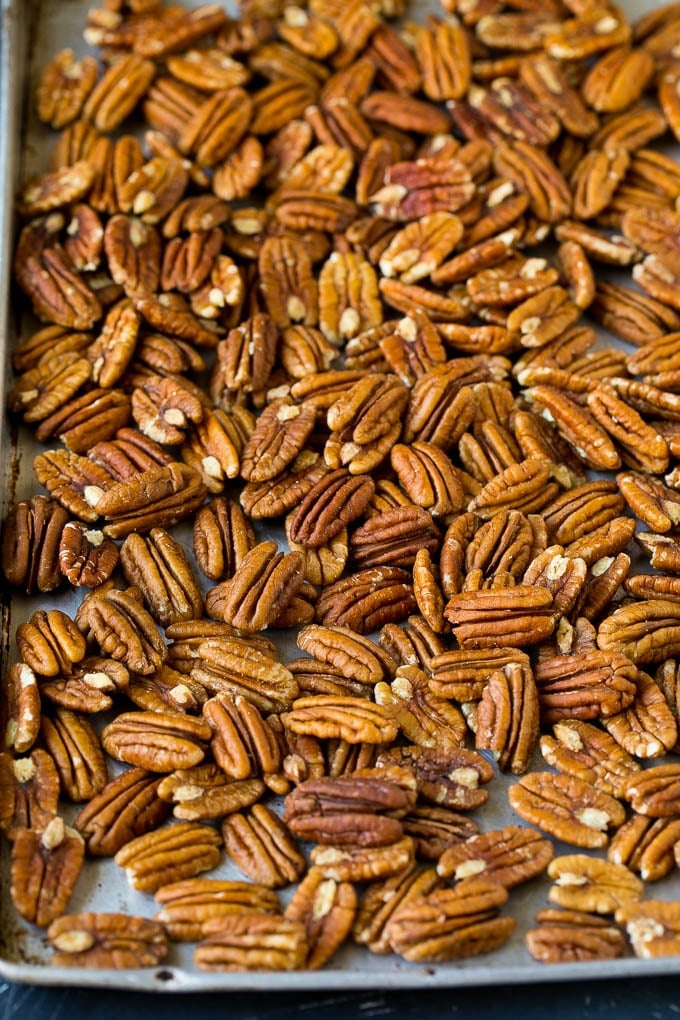 Pecan halves on a sheet pan.