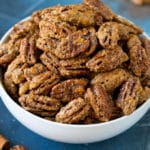 A bowl filled with homemade candied pecans.