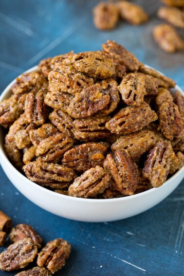 A bowl filled with homemade candied pecans.