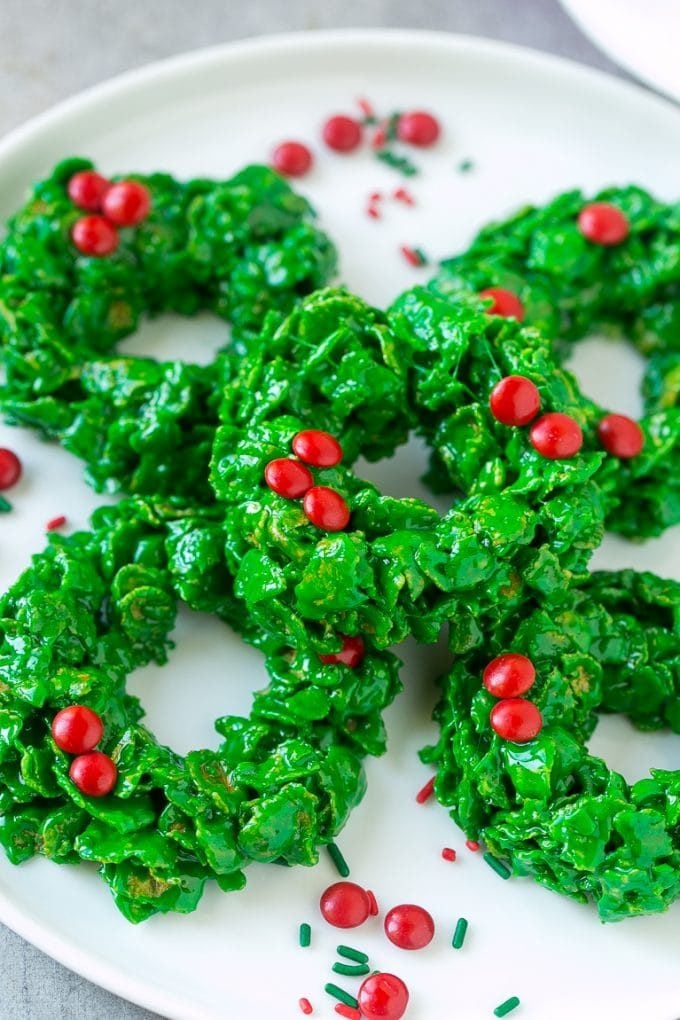 A plate of green cornflake wreath cookies.