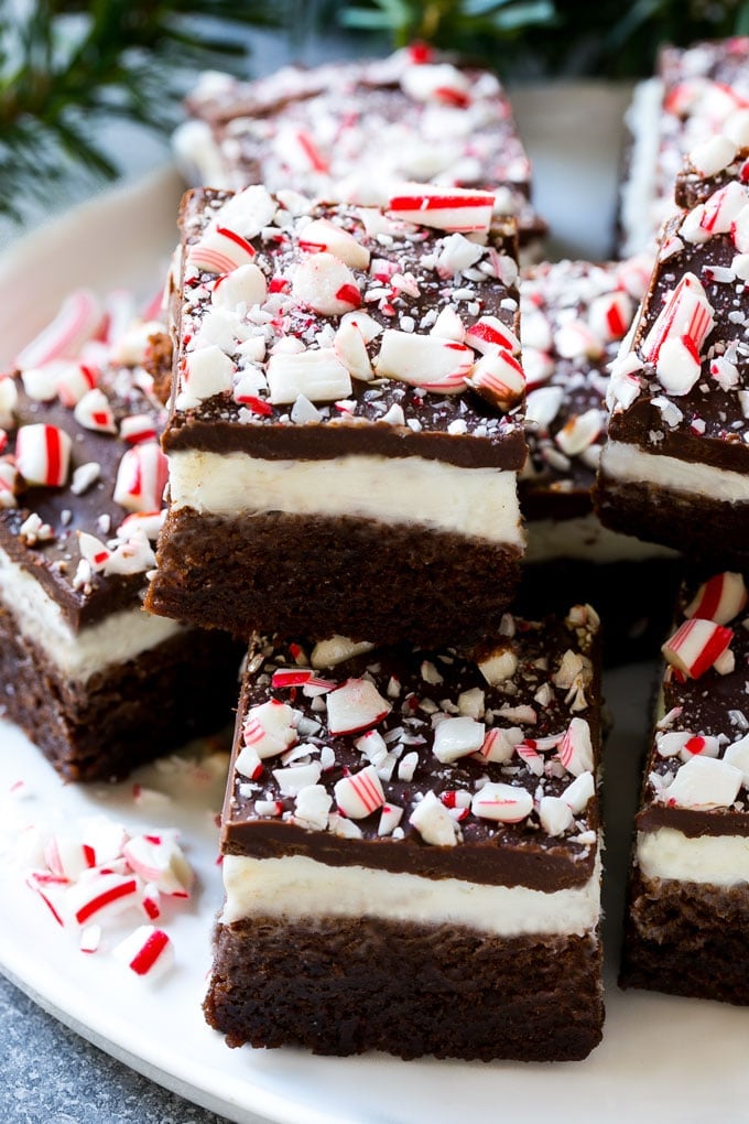 These layered peppermint brownies are full of flavor and so festive for the holidays with crushed candy canes on top.