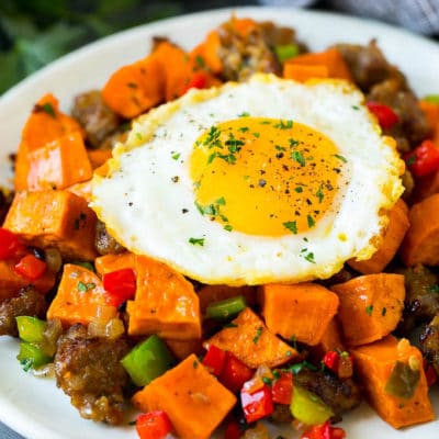 Sweet potato hash with sausage, topped with a fried egg.