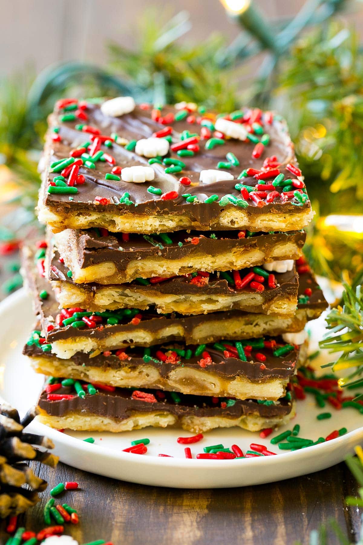 A stack of Christmas crack pieces on a plate.