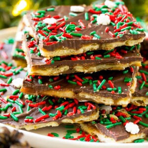 A platter of Christmas crack, garnished with holiday sprinkles.