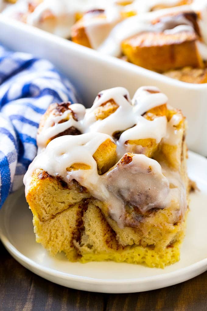 A slice of baked casserole topped with frosting.