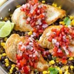This Salsa Chicken recipe is chicken breasts covered in homemade salsa and served over black beans and corn. It's an easy and healthy dinner that only uses one pan!