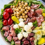 This recipe for antipasto salad is loaded with Italian meats, cheese and veggies, all tossed in a homemade zesty dressing.