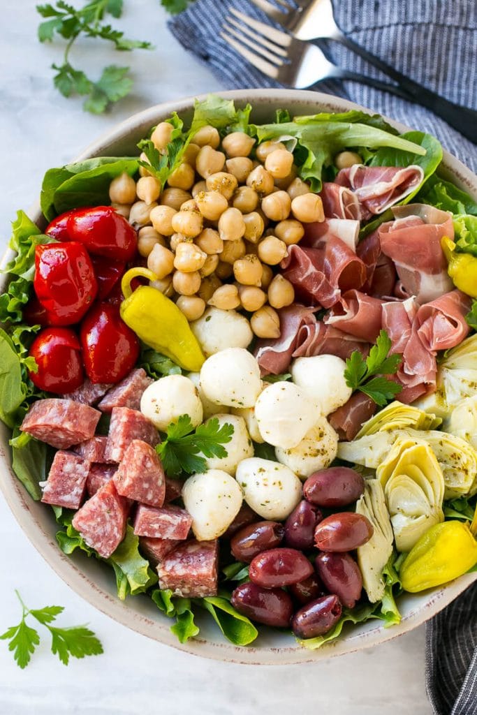 Antipasto salad made with salami, peppers, prosciutto, chickpeas and mozzarella.