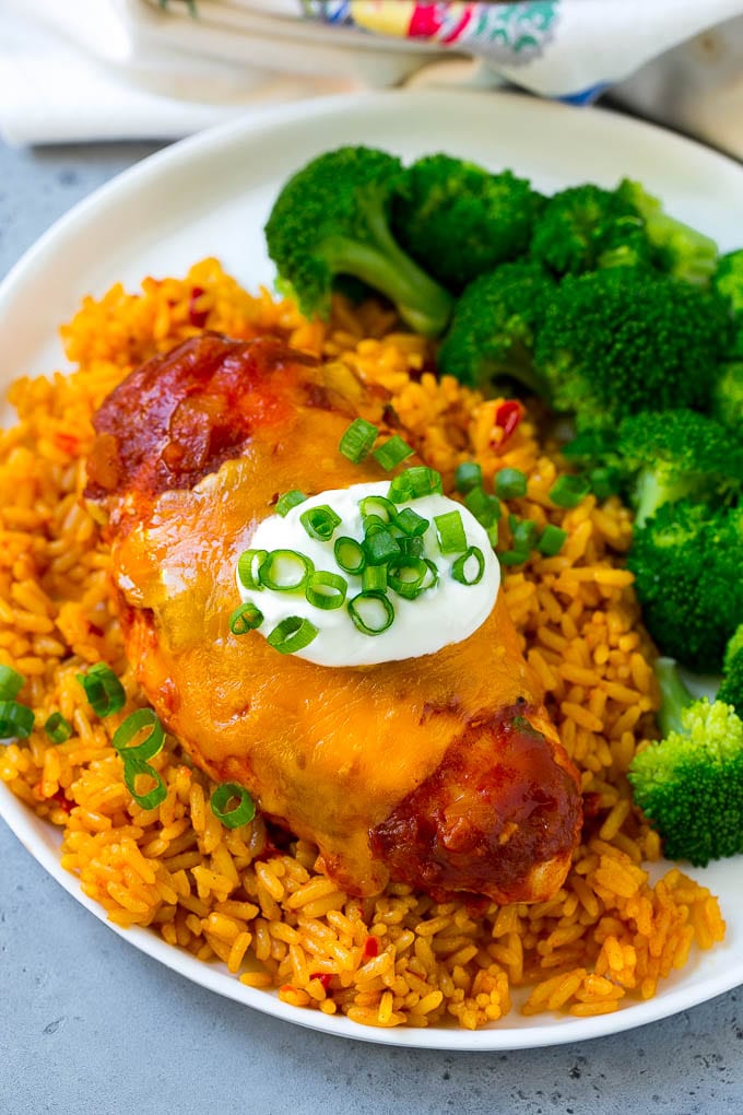 Salsa chicken served over Mexican rice with broccoli.