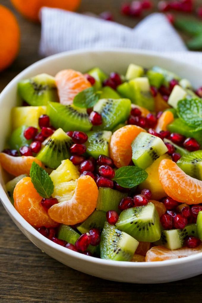 This winter fruit salad is made with oranges, kiwi, pineapple and pomegranates.