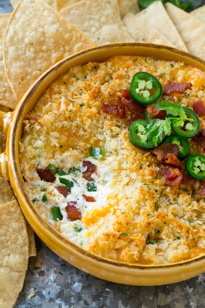 A dish of jalapeno popper dip with a crunchy breadcrumb topping.