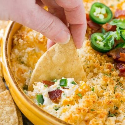 This jalapeno popper dip is creamy, cheesy, spicy, loaded with bacon and totally addicting! Serve it with tortilla chips for the ultimate party snack.