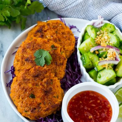 This recipe for Thai fish cakes is sweet and spicy salmon formed into patties and cooked to a golden brown. Serve the fish cakes with a cool cucumber salad and sweet chili dipping sauce for a delicious appetizer or main course!
