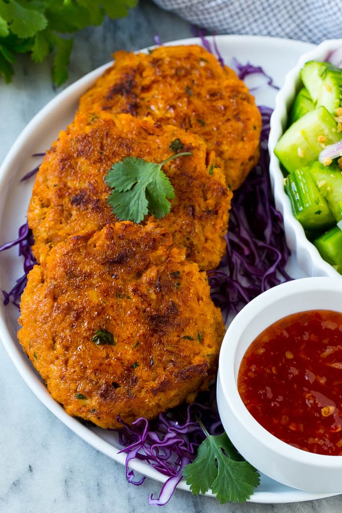 Thai fish cakes served over shredded cabbage with cucumber salad.