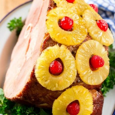 This ham with pineapple and cherries is a classic recipe with one secret ingredient that really takes it over the top. The ULTIMATE holiday ham!