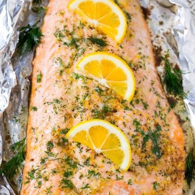 This recipe for salmon in foil is the easiest and most delicious way to eat fish! Salmon is flavored with lemon garlic butter, baked in foil, then topped with fresh dill. The perfect meal for any occasion!