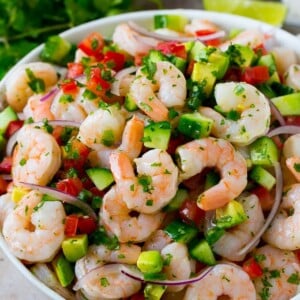 A bowl of shrimp ceviche marinated in citrus juice with tomato, avocado, cilantro and jalapeno.