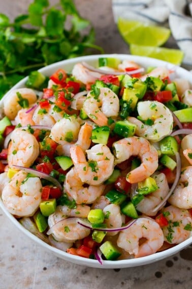 A bowl of shrimp ceviche marinated in citrus juice with tomato, avocado, cilantro and jalapeno.