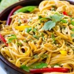 This recipe for Thai peanut noodles is full of colorful veggies and tossed in an easy homemade peanut sauce. No need for take out when you can make your own in just 20 minutes!