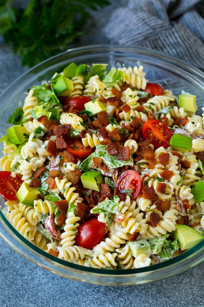 BLT Pasta Salad Recipe | Easy Pasta Salad | Bacon Pasta Salad #salad #pasta #blt #bacon #avocado #dinner #dinneratthezoo A bowl of BLT pasta salad with avocado in a creamy dressing.