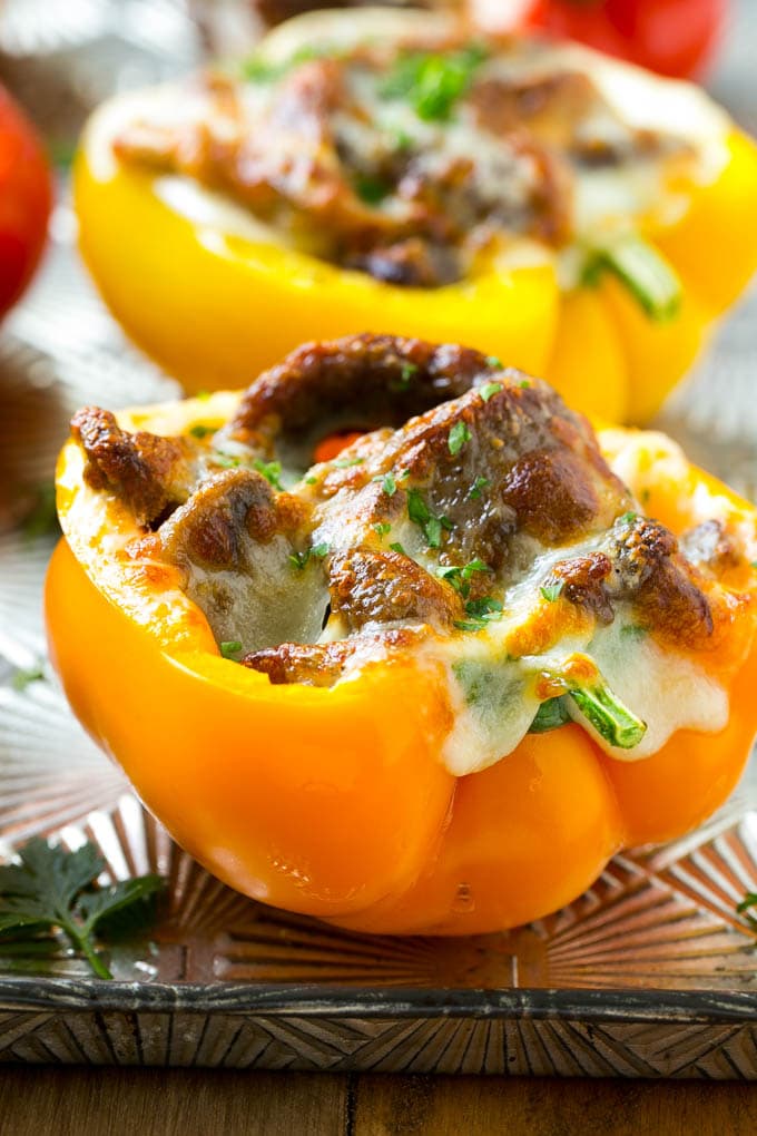 A bell pepper stuffed with meat, mushrooms and melted cheese.