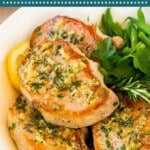 These baked boneless pork chops are cooked in a garlic, rosemary and butter sauce to tender and juicy perfection.