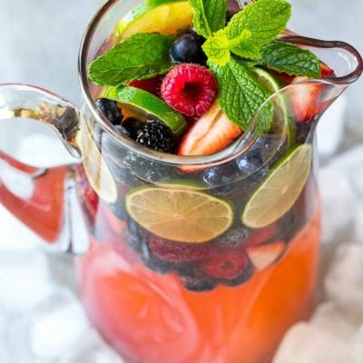 This berry champagne punch recipe is festive, refreshing and super easy to make! It's the perfect cocktail for any summer party.