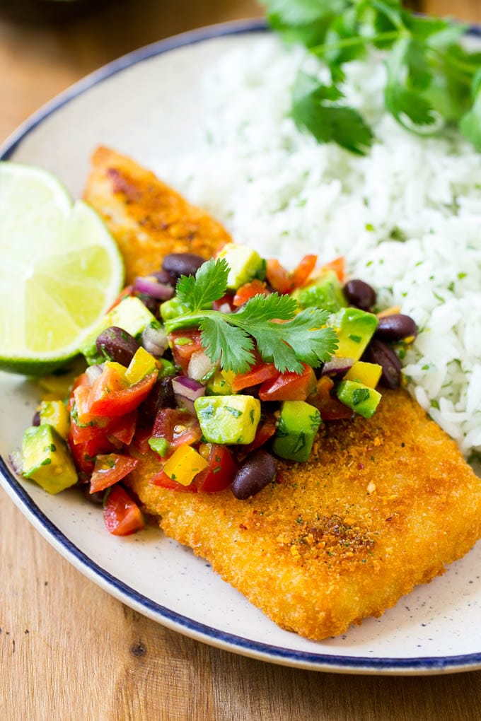 Fajita fish fillet topped with black beans, vegetables and avocado.