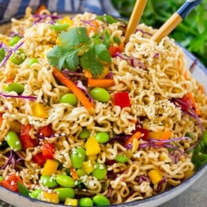 This easy Asian noodle salad recipe is ramen noodles and colorful veggies all tossed in a sesame hoisin dressing. The perfect side dish for any summer celebration!