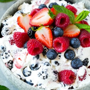 This berry cheesecake salad recipe is a variety of fresh berries tossed in a light and creamy cheesecake mixture. The perfect summer salad!