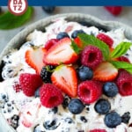 This berry cheesecake salad recipe is a variety of fresh berries tossed in a light and creamy cheesecake mixture.