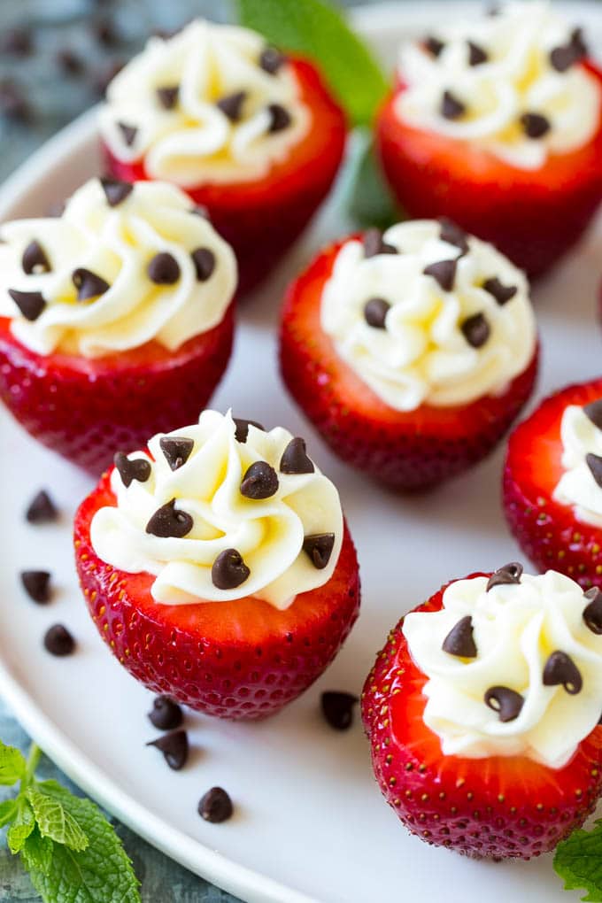 These cheesecake stuffed strawberries have a creamy filling piped into the berries and are finished off with chocolate chips.