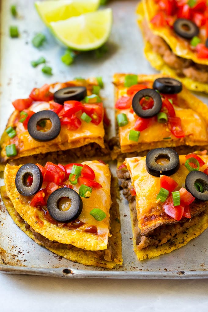 A Mexican pizza cut into 4 slices.
