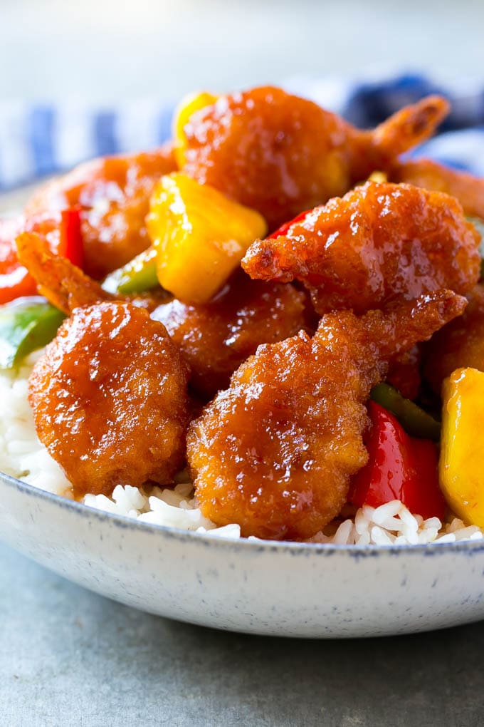 Sweet and sour shrimp with pineapple and peppers, served over rice.