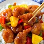 This sweet and sour shrimp recipe is made with crispy shrimp, colorful veggies and pineapple, all tossed in a homemade sweet and sour sauce. The perfect quick and easy summer dinner that's perfect for entertaining!