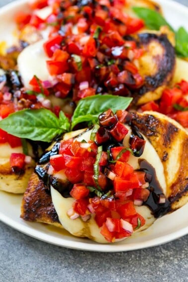 Grilled bruschetta chicken topped with melted mozzarella cheese, tomato basil bruschetta and a drizzle of balsamic glaze.