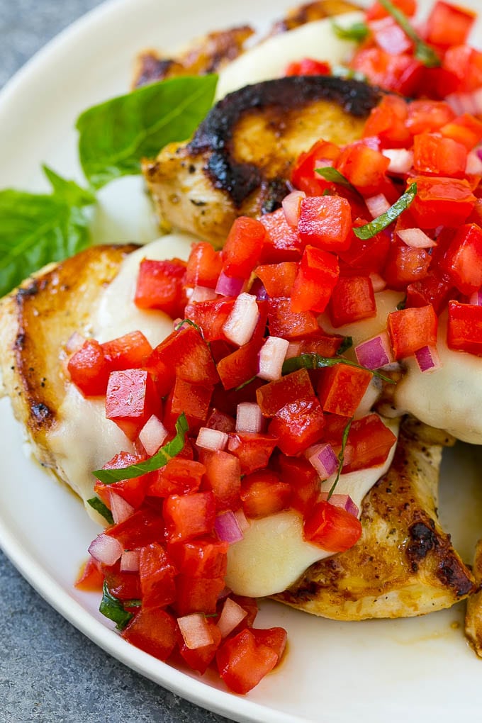 Grilled chicken with mozzarella cheese and tomato bruschetta.